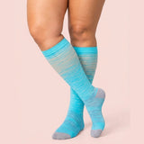 velora patterns wide fit compression socks beige gray lines knee high women pose crossed ankles