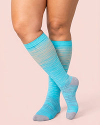 velora patterns wide fit compression socks beige gray lines knee high women pose crossed ankles