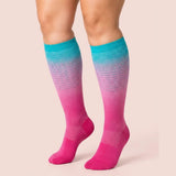 velora patterns wide fit compression socks gradient blue knee high women pose foot tucked