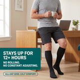 Stays up for 12+ hours with no rolling — man wearing black Velora compression socks
